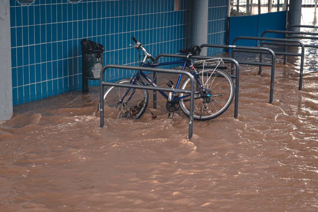 A parked bike surrounded by flood water