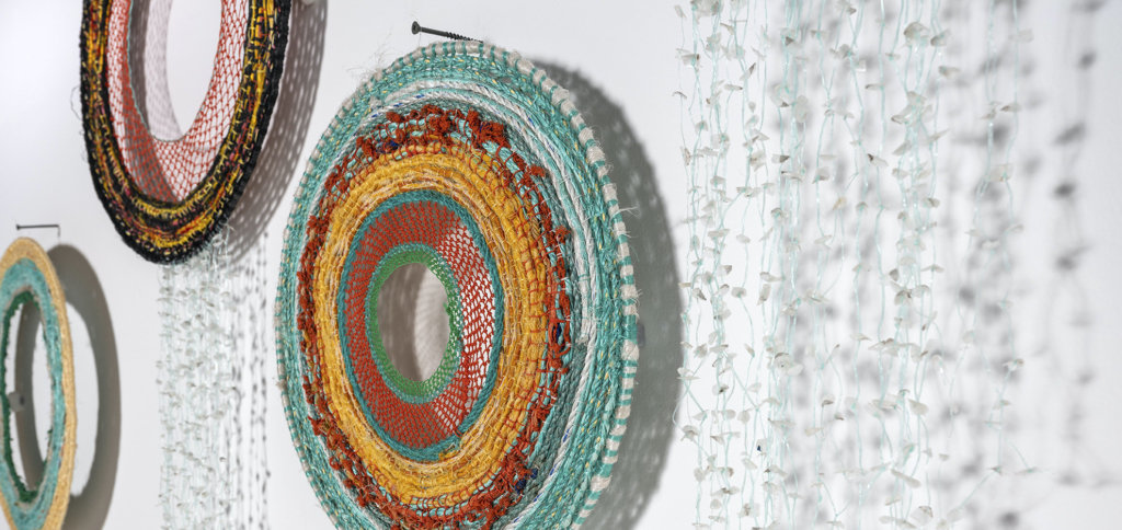An artwork by Elisa Jane Carmichael and Sonja Carmichael consisting of ghost net, fibres and fish scales
