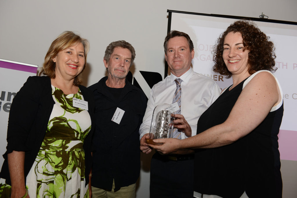 Dr Lisa Chandler from the University of the Sunshine Coast, artist Peter Hudson, and John Waldron from Blue Sky View accepting a Gallery and Museum Achievement Award