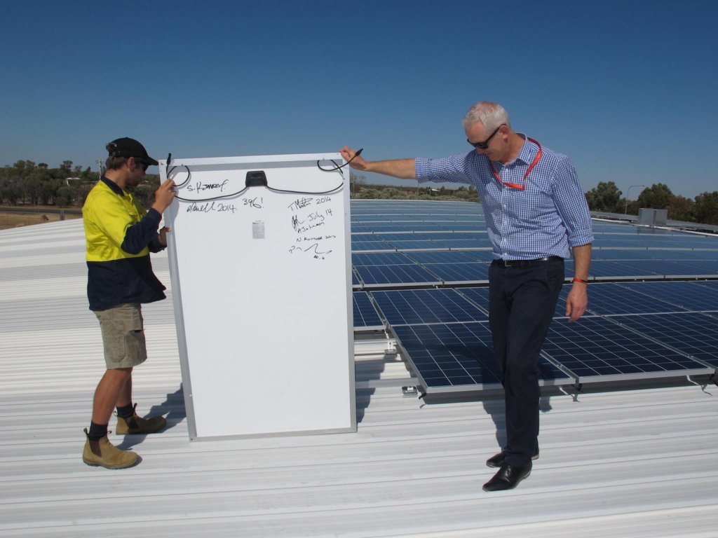 Qantas Founders Museum CEO, Tony Martin, with final solar panel